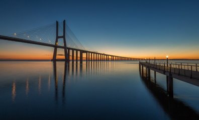 Fototapeta na wymiar Sunrise in Lisbon, under the Vasco da Gama Bridge, portugal
