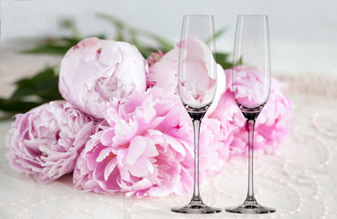 Mockup - 2 champagne glasses, with peonies behind, next to flower arrangement, perfect for businesses who sell decals, vinyl stickers, just overlay your design