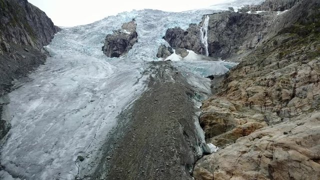 Blue ice glacier front. Buer glacier, Norway from air view from drone