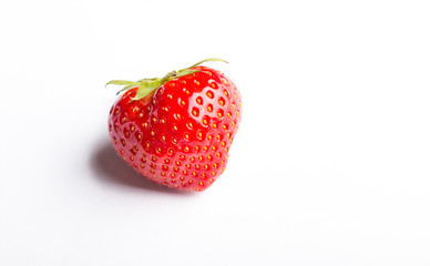 close up of a strawberry on a white background