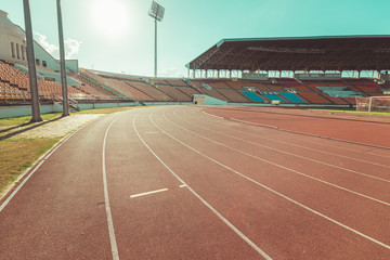 Red running track in stadium , vintage