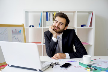 Businessman dreaming in office