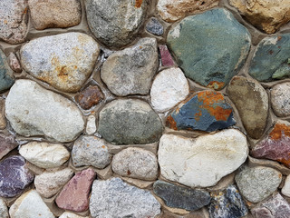 Texture of multicolored coastal stones