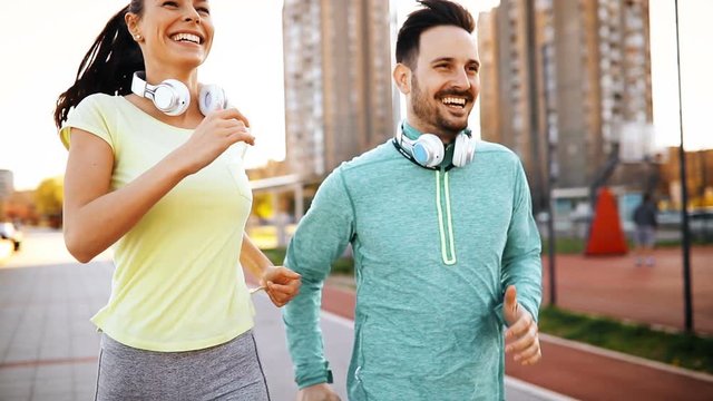 Beautiful couple jogging and fitness training outdoor