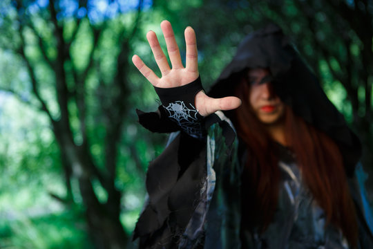 Photo of witch in cloak