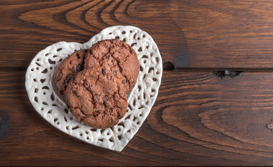 chocolate cookies on a heart shaped plate