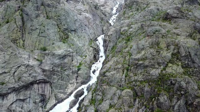 Blue ice glacier front. Buer glacier, Norway from air view from drone