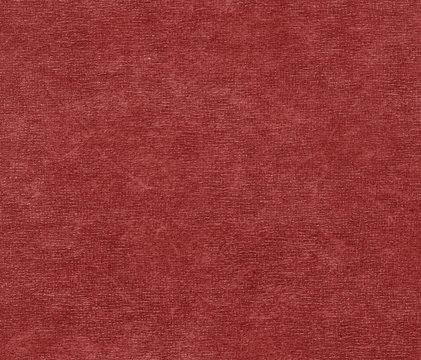 Red color artificial leather surface.