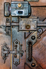 Vintage metal door lock on wooden door