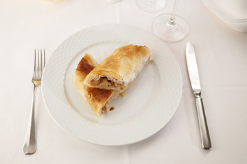 Apple pie slice arranged on a plate, Traditional dessert in elegant setting, Selective focus with soft light