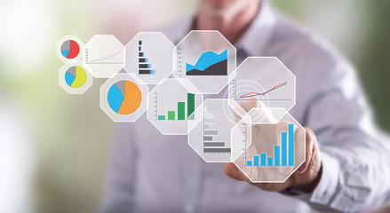 Man touching a graphic analysis concept on a touch screen