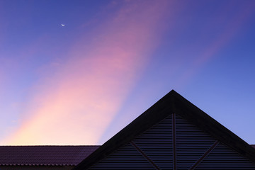 Fototapeta na wymiar The silhouette scene of the house building with the twilight sky.