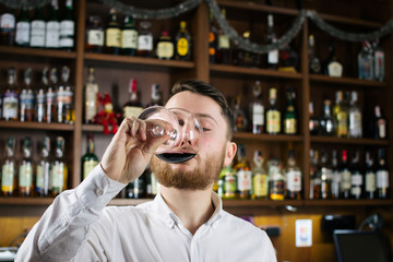 Sommelier tasting the wine