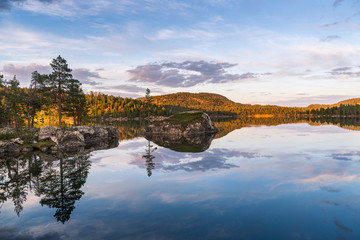 Midnight sun in Lapland.Peaceful lake view.