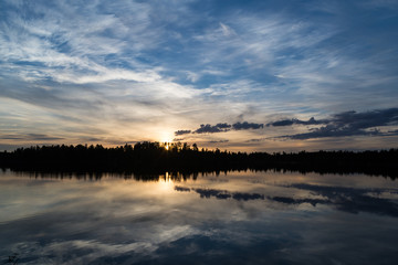 Midnight sun in Lapland.Peaceful lake view.