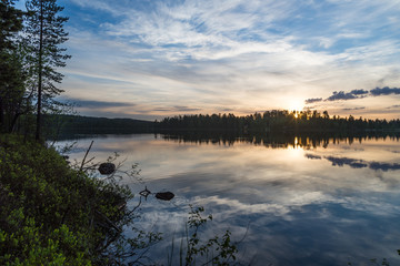 Midnight sun in Lapland.Peaceful lake view.