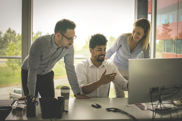 Business people using technology and having conversation. Business people at the office.
