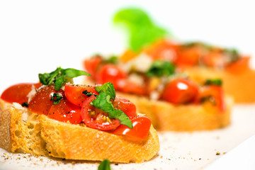 Fototapeta na wymiar Fresh tomato basil bruschetta on toast