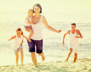 couple with two children running