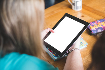 woman looking on a tablet