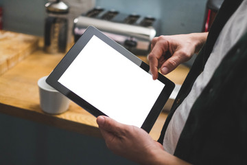 Tablet in front of a coffee machine