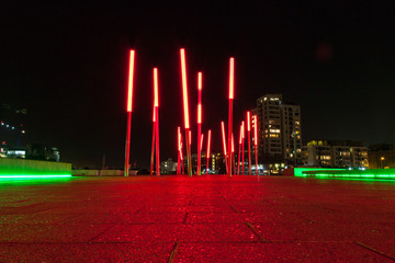 Red lightning posts in docklands at night. Dublin, Ireland.
