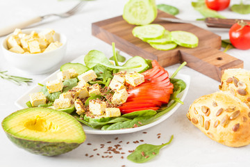 Fototapeta na wymiar Vegetarian green salad with tofu.