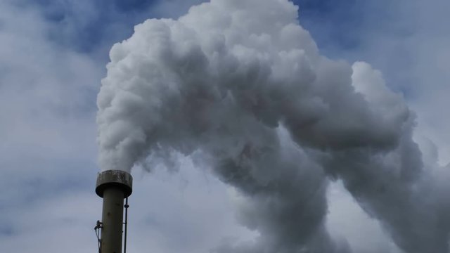Billowing steam from smoke stack, close up 4k