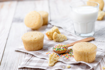 Tasty cupcakes on a white wooden table