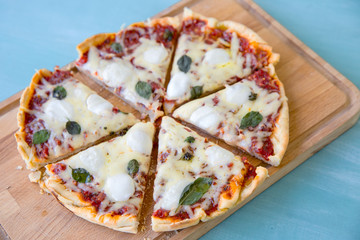 pizza with bacon, mozzarella on a blue background