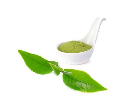 green tea powder and leaf on white background