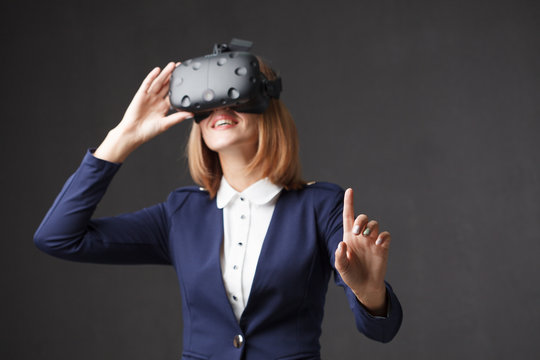 Woman with virtual reality goggles. Studio shot, white backgroun