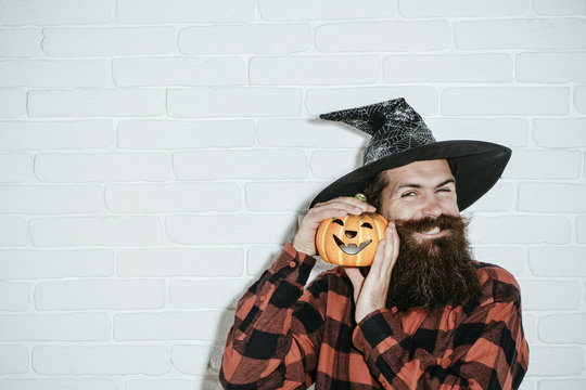 Halloween Hipster With Beard Smiling In Wizard Hat