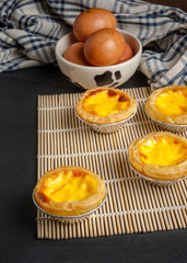 egg tart on black wood