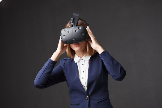 Woman with virtual reality goggles. Studio shot, white backgroun