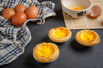 egg tart on black wood