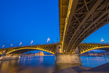 Budapest, Hungary - The beautiful illuminated Margaret Bridge with the Parliament of Hungary at blue hour