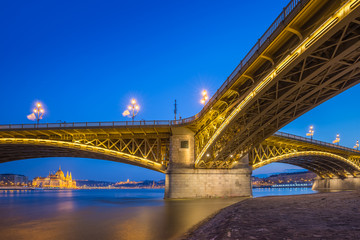 Budapest, Hungary - The beautiful illuminated Margaret Bridge with the Parliament of Hungary at...