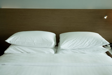 Fototapeta na wymiar White bed and white pillows
