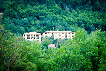 Fototapeta na wymiar Buildings in the forest at the Zarouhla village which located in Greece, Aroanina mountain, Peloponnse