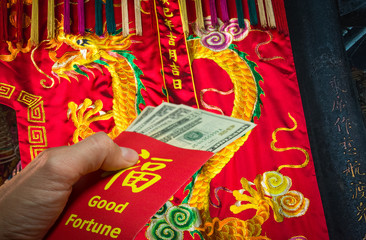 Chinese Dragon and red envelope or hong bao during Chinese New Year in China and Taiwan