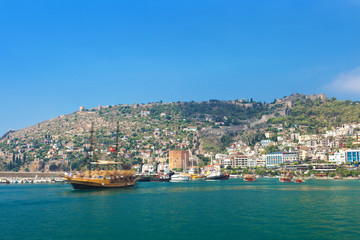 Fototapeta na wymiar Tourist boat in Alanya harbor. Alanya, Turkey