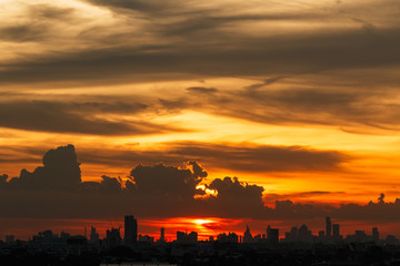 Sunset light at city of Bangkok with building silhouette