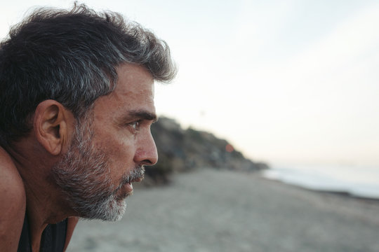 Mature Surfer Man On The Beach