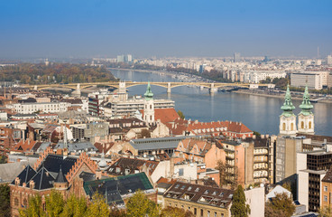 Fototapeta na wymiar European landmarks. Panoramic view of Budapest with bell towers of the St. Anne's Church and Parliament , Hungary