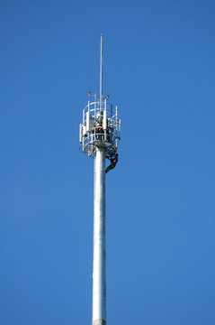 workers on a telecommunication tower