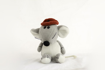 Mouse doll wearing a red hat on white background.