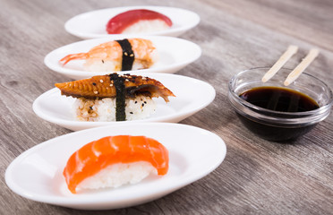 four kinds Nigirisushi on oval saucers
