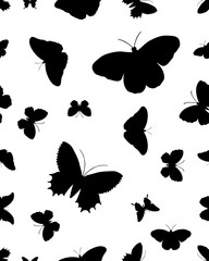 Seamless pattern with black silhouettes of butterflies on white