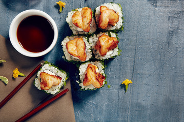 Menu of Japanese sushi rolls on black background